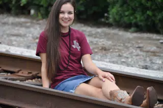 Emily Modeling on Railroad Tracks