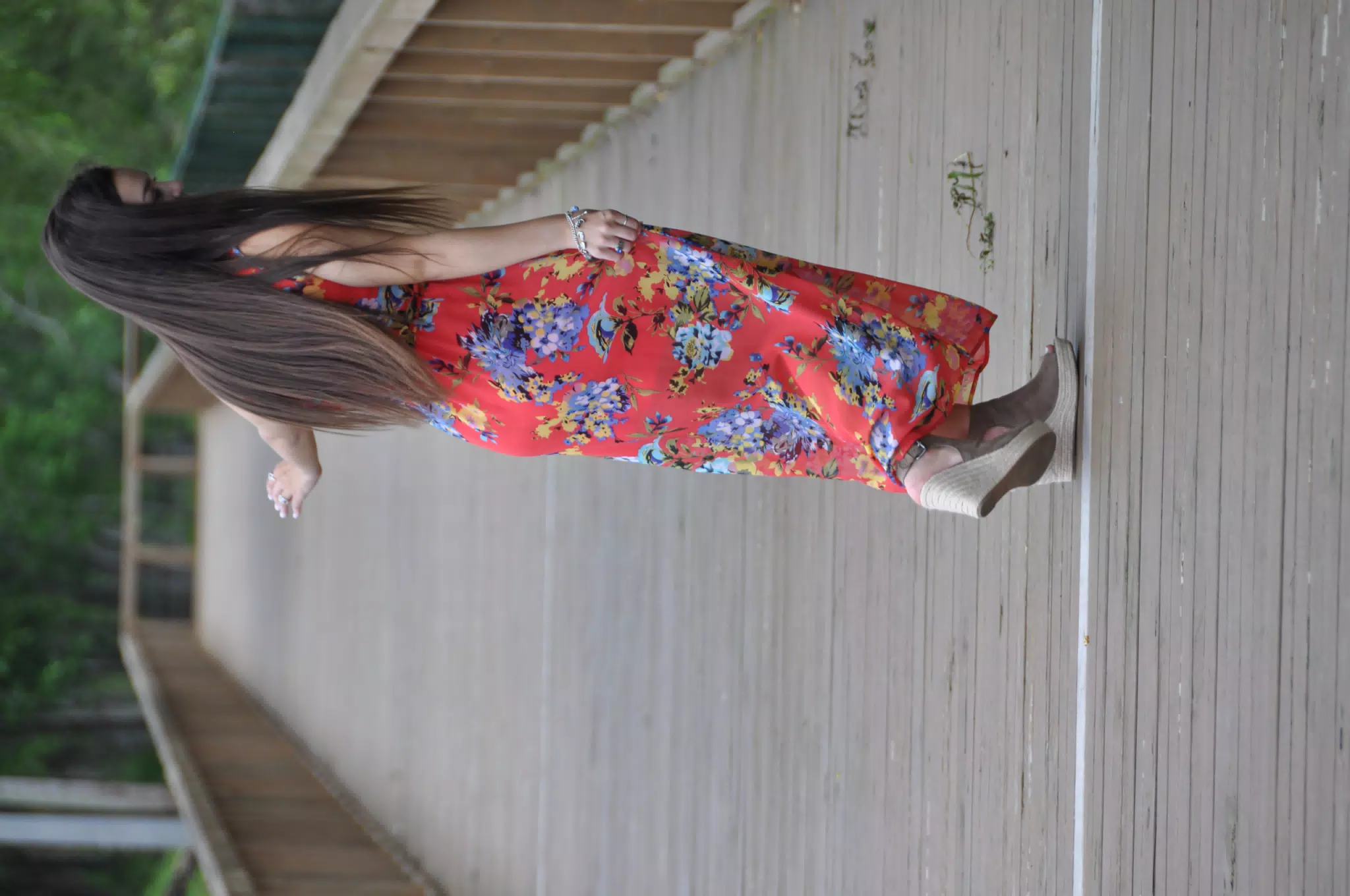 Teen Model Dancing in Red Dress on Boardwalk
