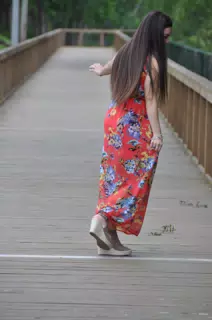 Teen Model Dancing in Red Dress on Boardwalk
