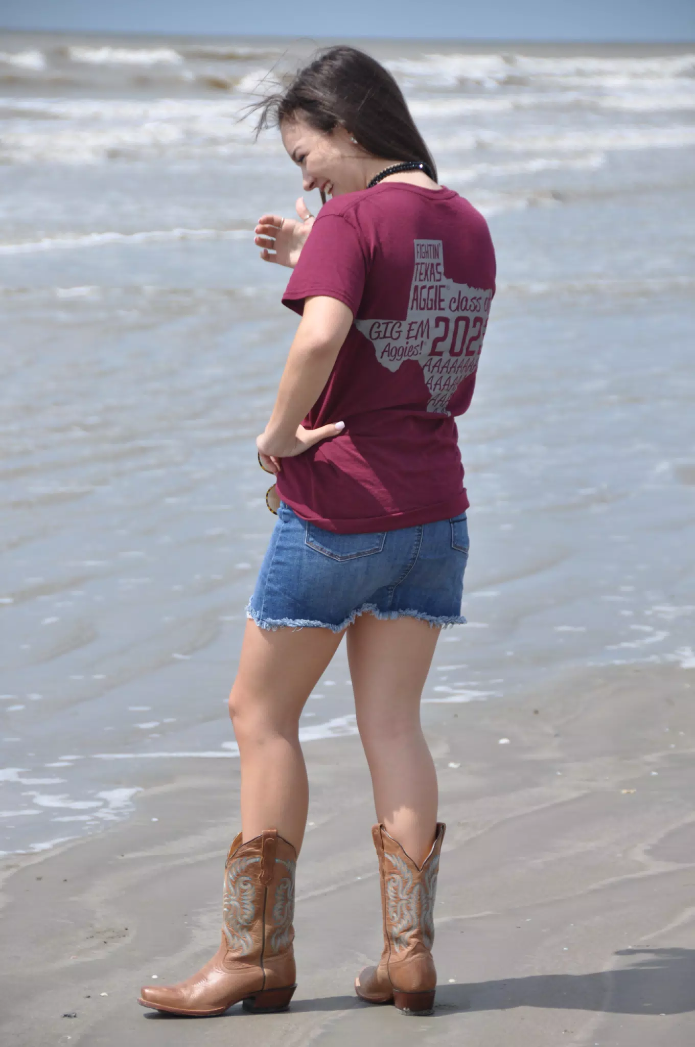 Laughing Teen in Cowboy Boots and Jean Skirt on Beach in Texas