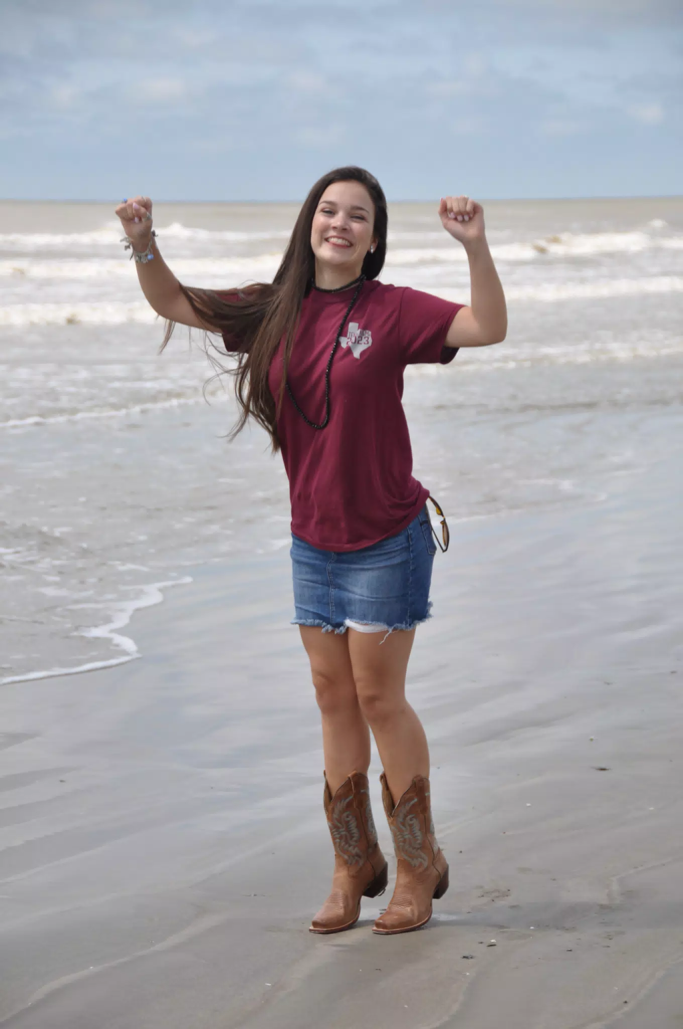 Model Jumping in Cowboy Boots on Galveston Beach