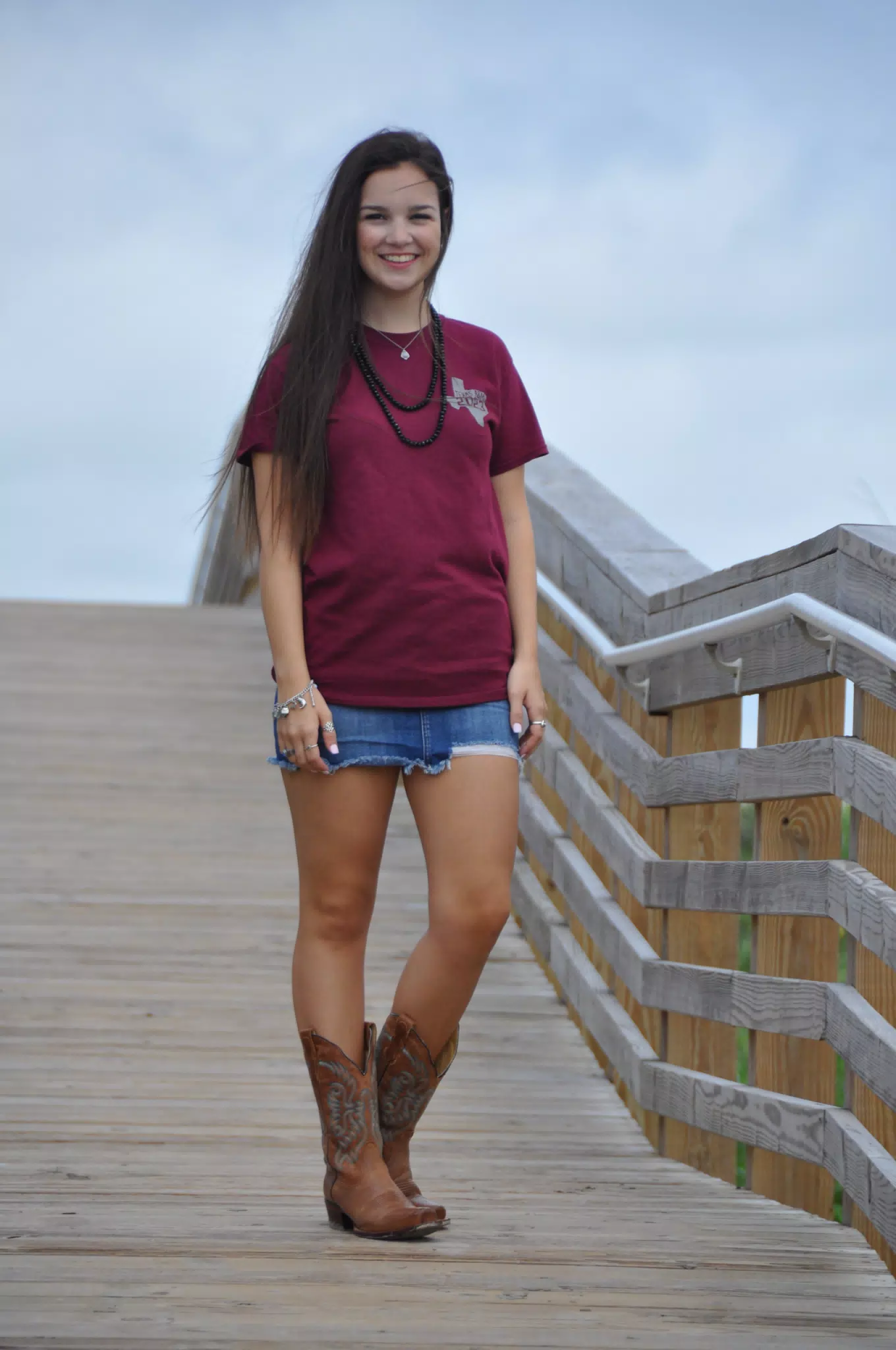 Brunette Beauty in Mini Skirt and Cowgirl Boots on Galveston Beach Boardwalk