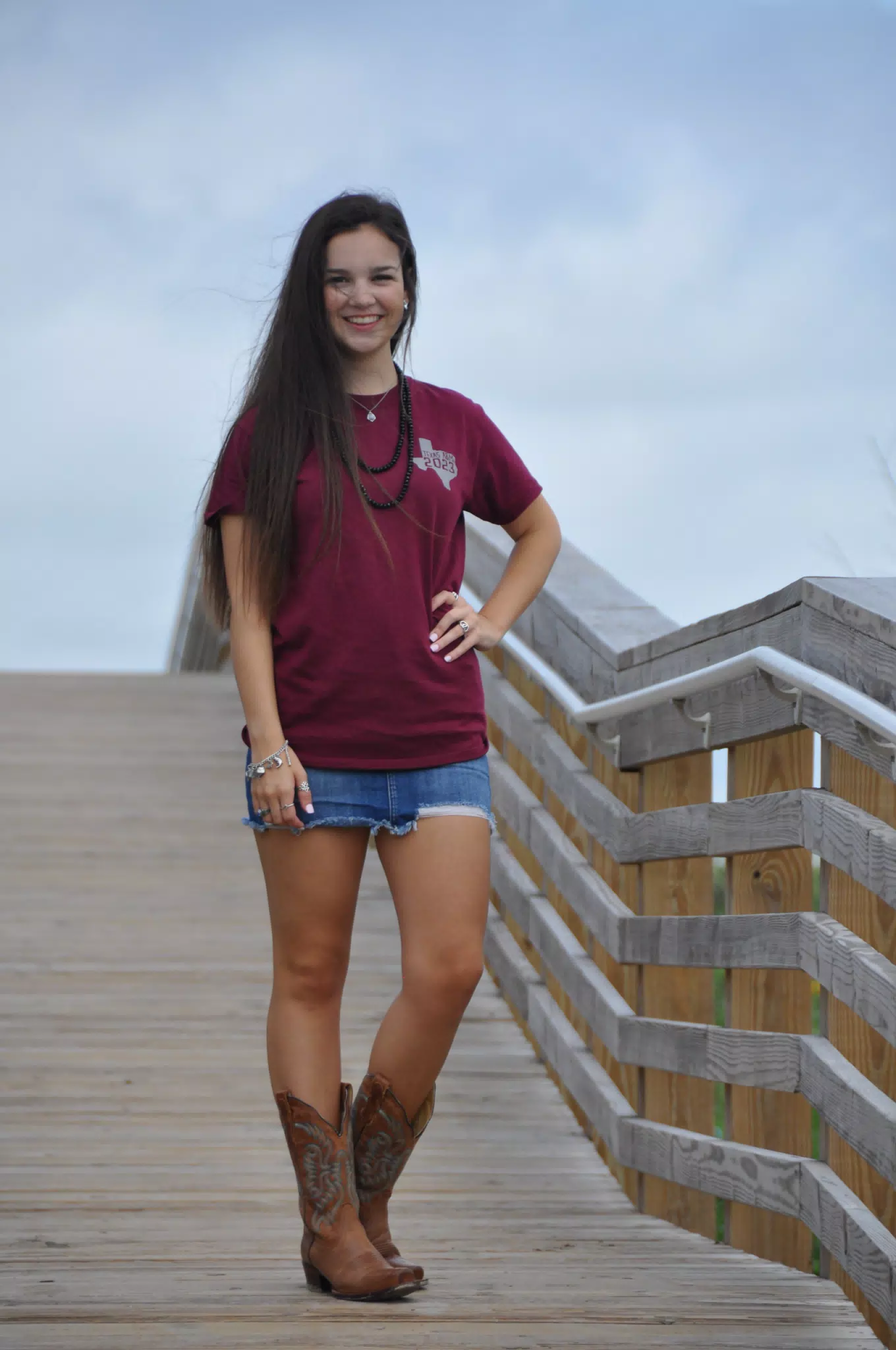 Model in Miniskirt and Boots on Galveston Beach Boardwalk