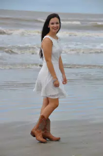Model in White Dress and Cowgirl Boots on the Beach in Galveston