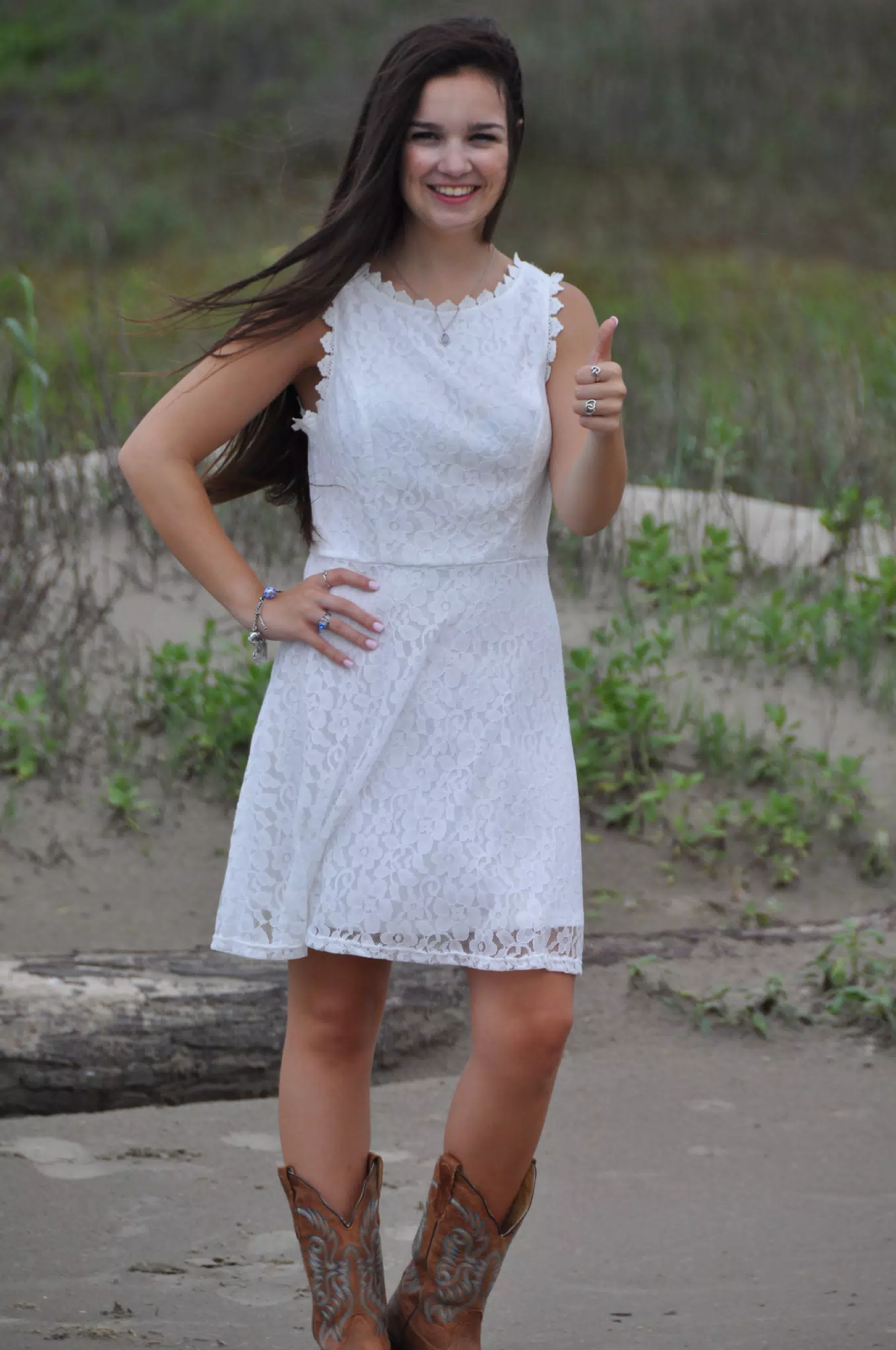 Girl Thumbs Up in White Dress on Beach