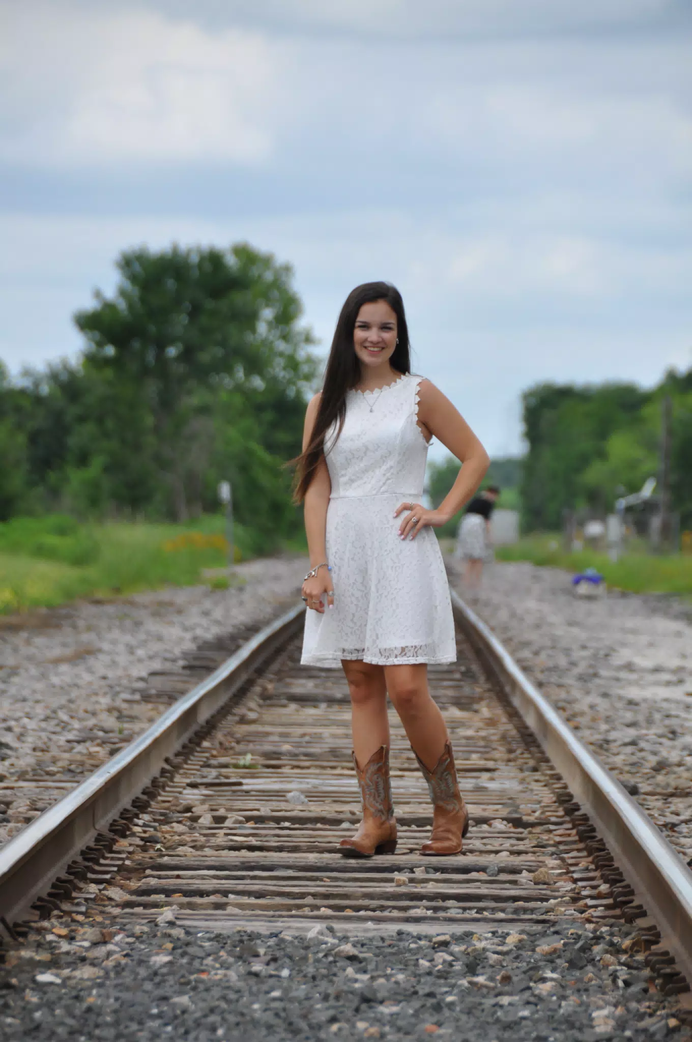 Emily Modeling on Train Tracks in White Dress