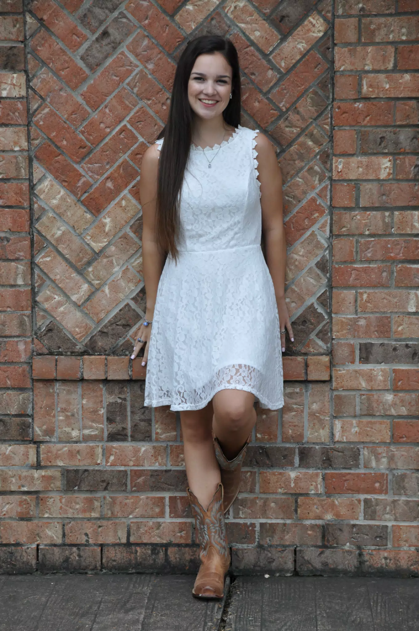 Teen Model Against Brick Wall in White Dress