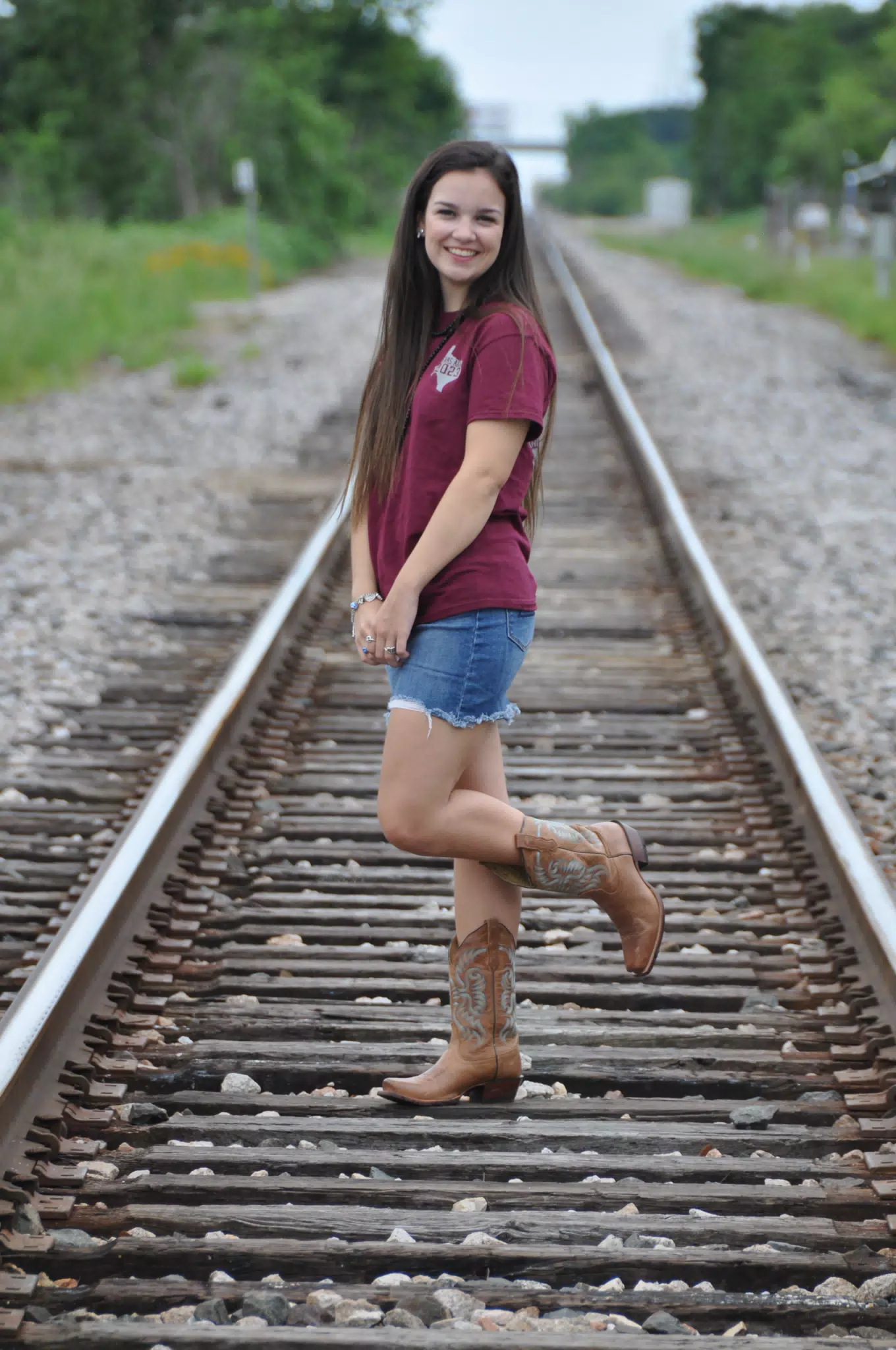 Emily Modeling on Train Tracks in Skirt and Boots