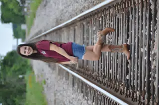 Emily Modeling on Train Tracks in Skirt and Boots