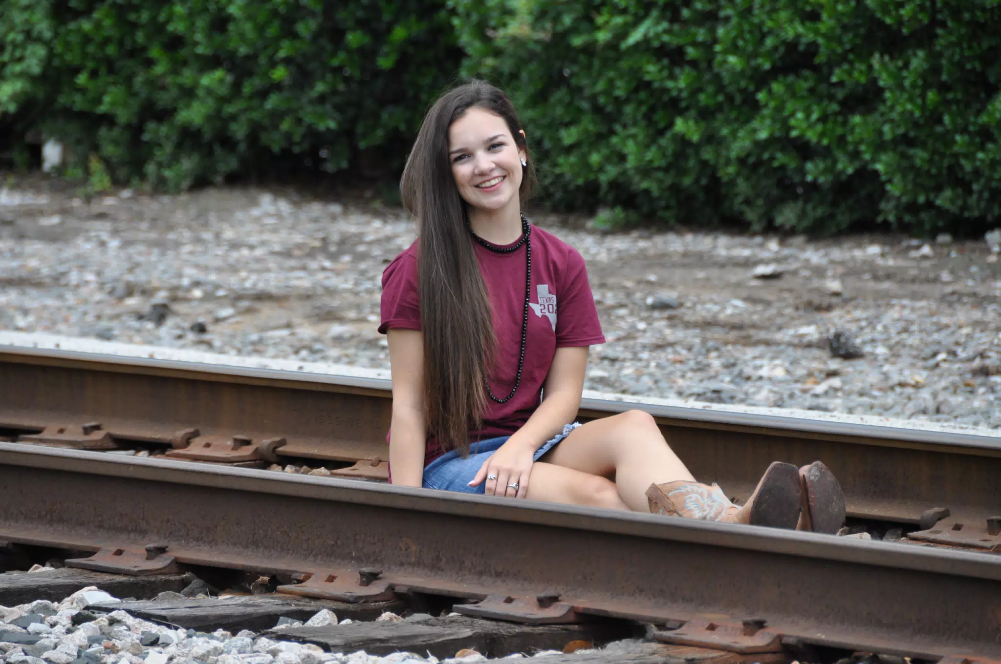 Emily Sitting on Railroad Tracks