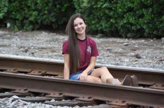 Emily Sitting on Railroad Tracks