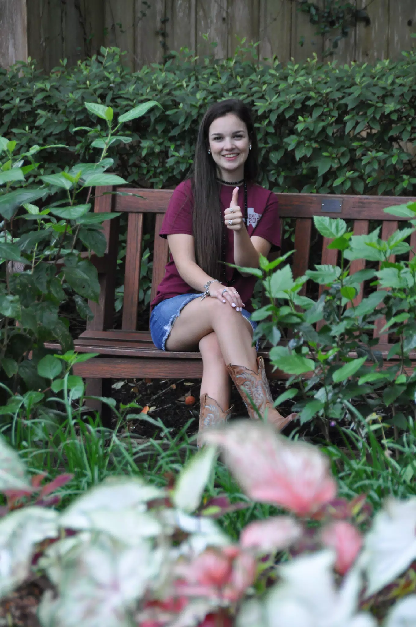 Emily Thumbs Up Posing on Park Bench