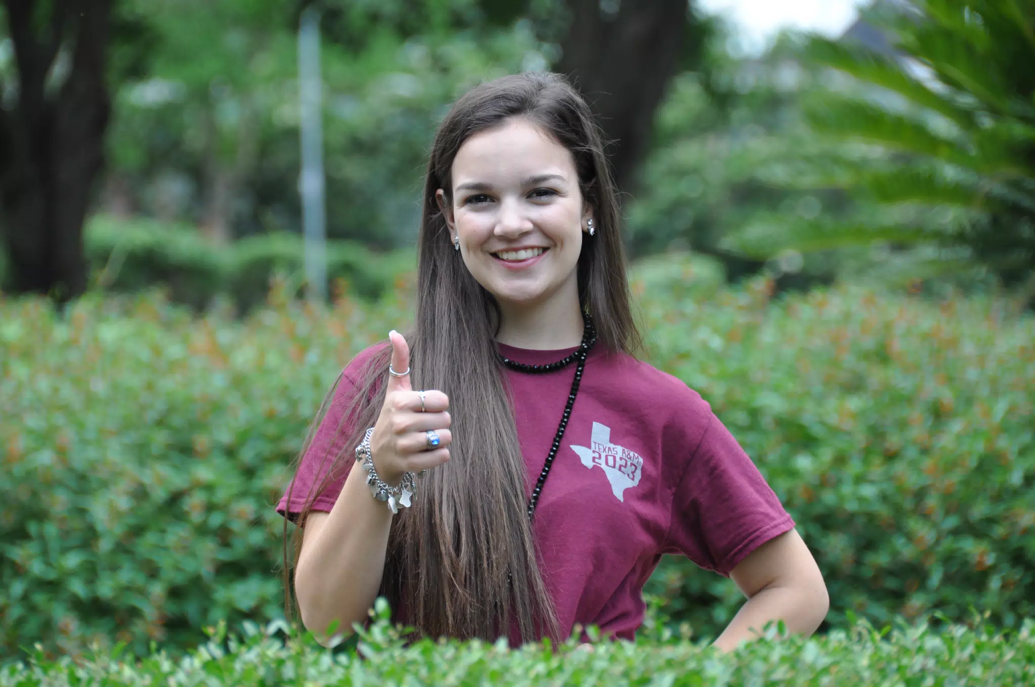 Teen Model Emily Thumbs Up in Park in Texas