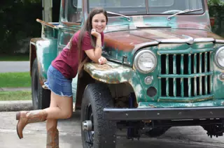 Girl in Miniskirt and Cowgirl Boots on Jeep