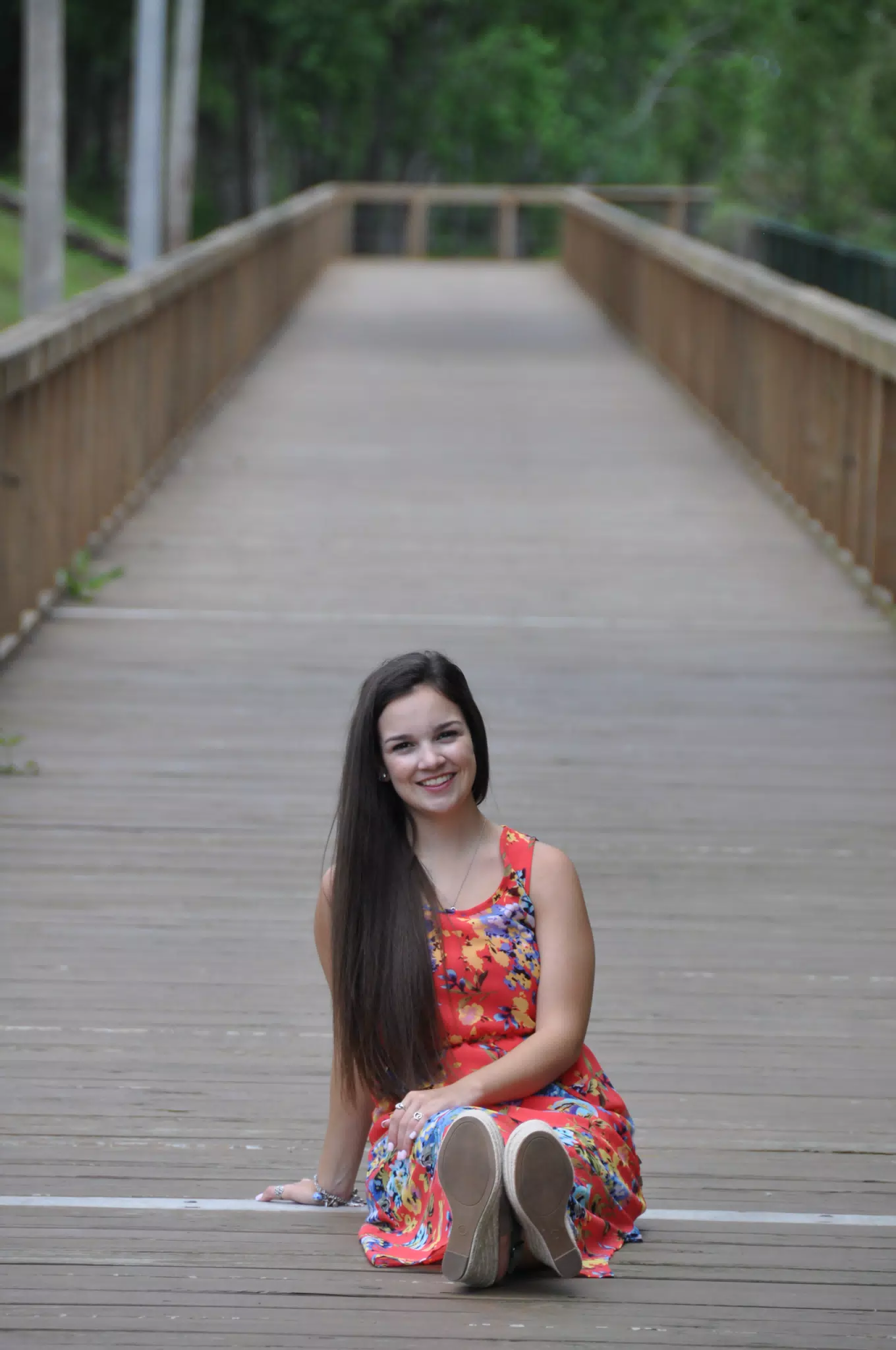 Brunette Model in Red Dress on Boardwalk in Texas