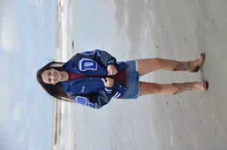 Emily on Galveston Beach in Jean Skirt, Boots and Letterman Jacket