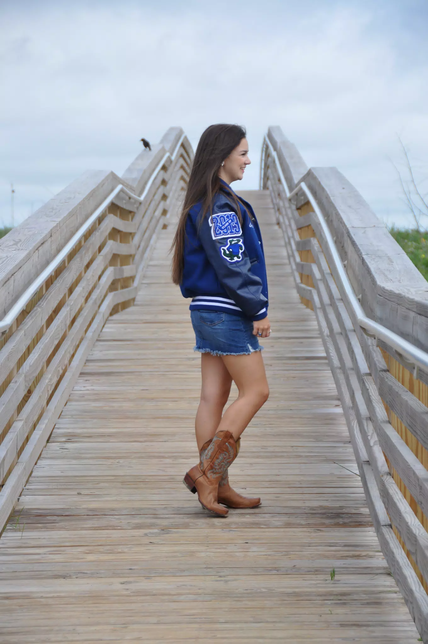 Emily on Galveston Beach Boardwalk in Jean Skirt and Cowgirl Boots
