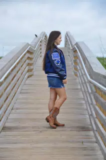 Emily on Galveston Beach Boardwalk in Jean Skirt and Cowgirl Boots