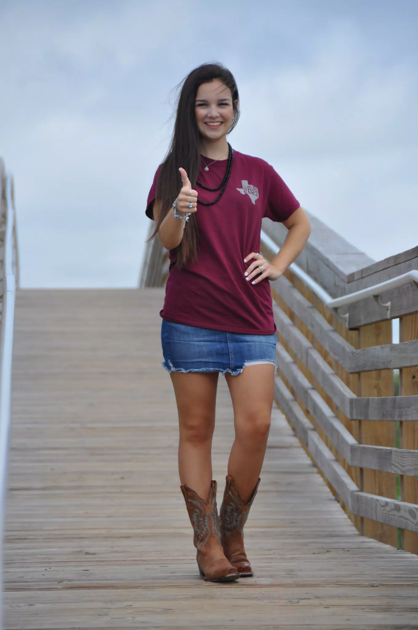 Girl in Boots and Skirt on Boardwalk on Galveston Beach