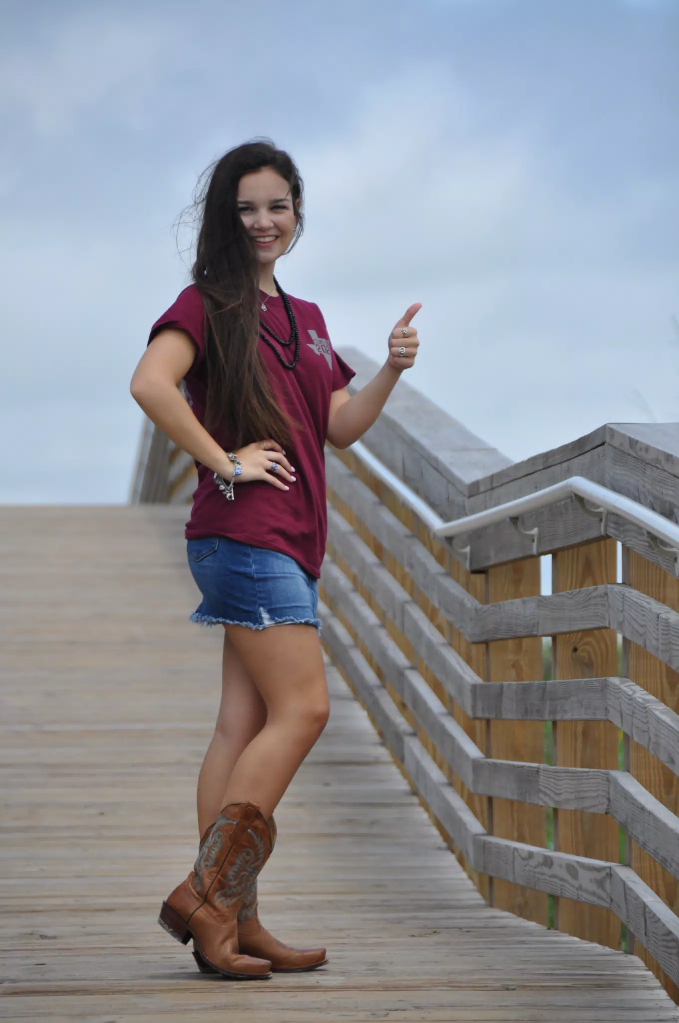 Thumbs Up Model in Skirt on Boardwalk in Texas