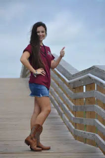 Thumbs Up Model in Skirt on Boardwalk in Texas