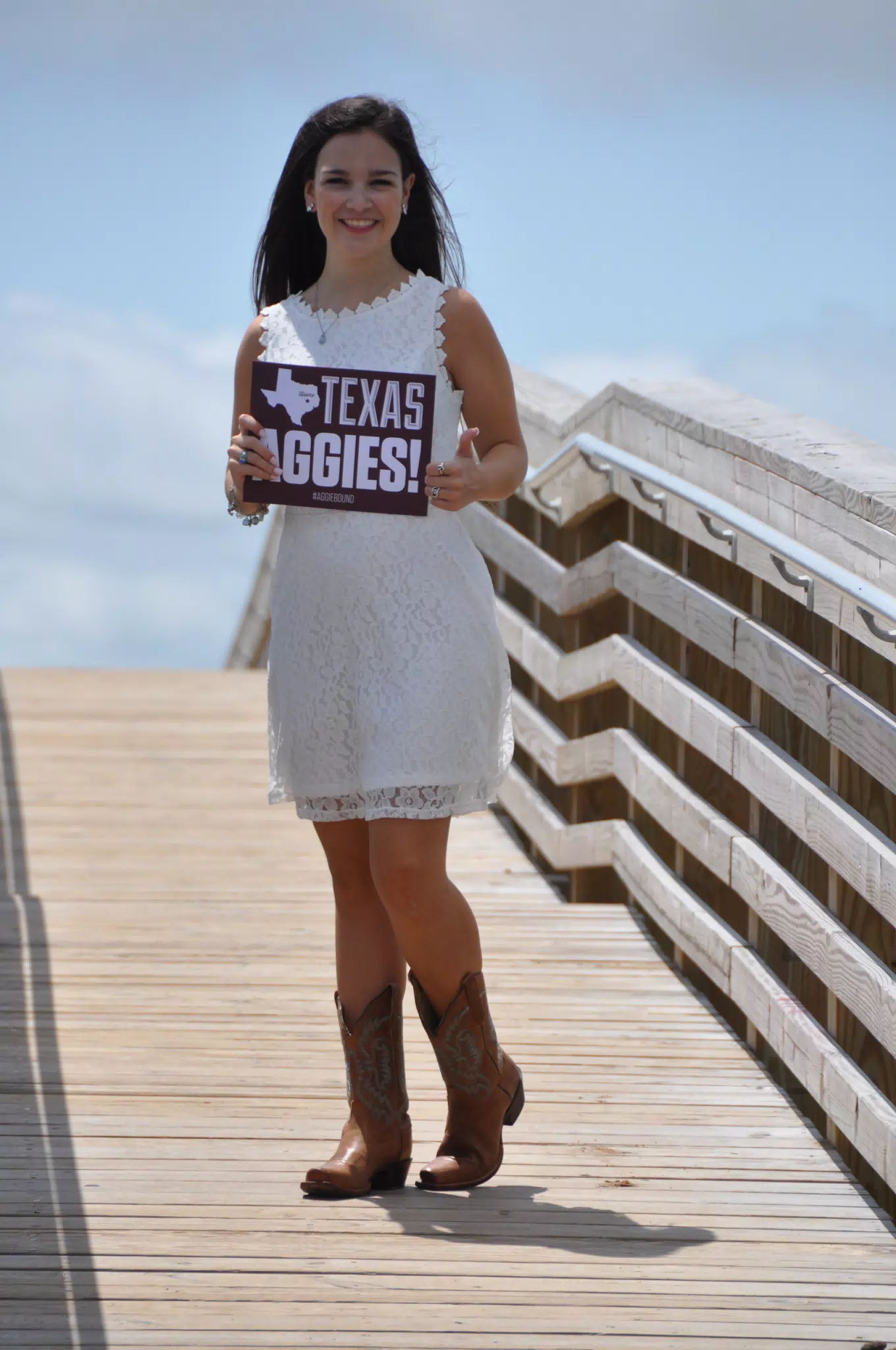 Emily with Aggies Sign