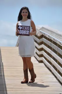 Emily with Aggies Sign