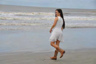 Emily Walking on Beach in White Dress