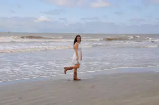 Girl in Boots on Beach