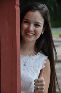 Smiling Brunette Model in White Dress