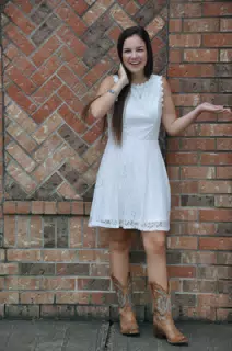 Teen Cowgirl in White Dress & Cowboy Boots in Texas Modeling