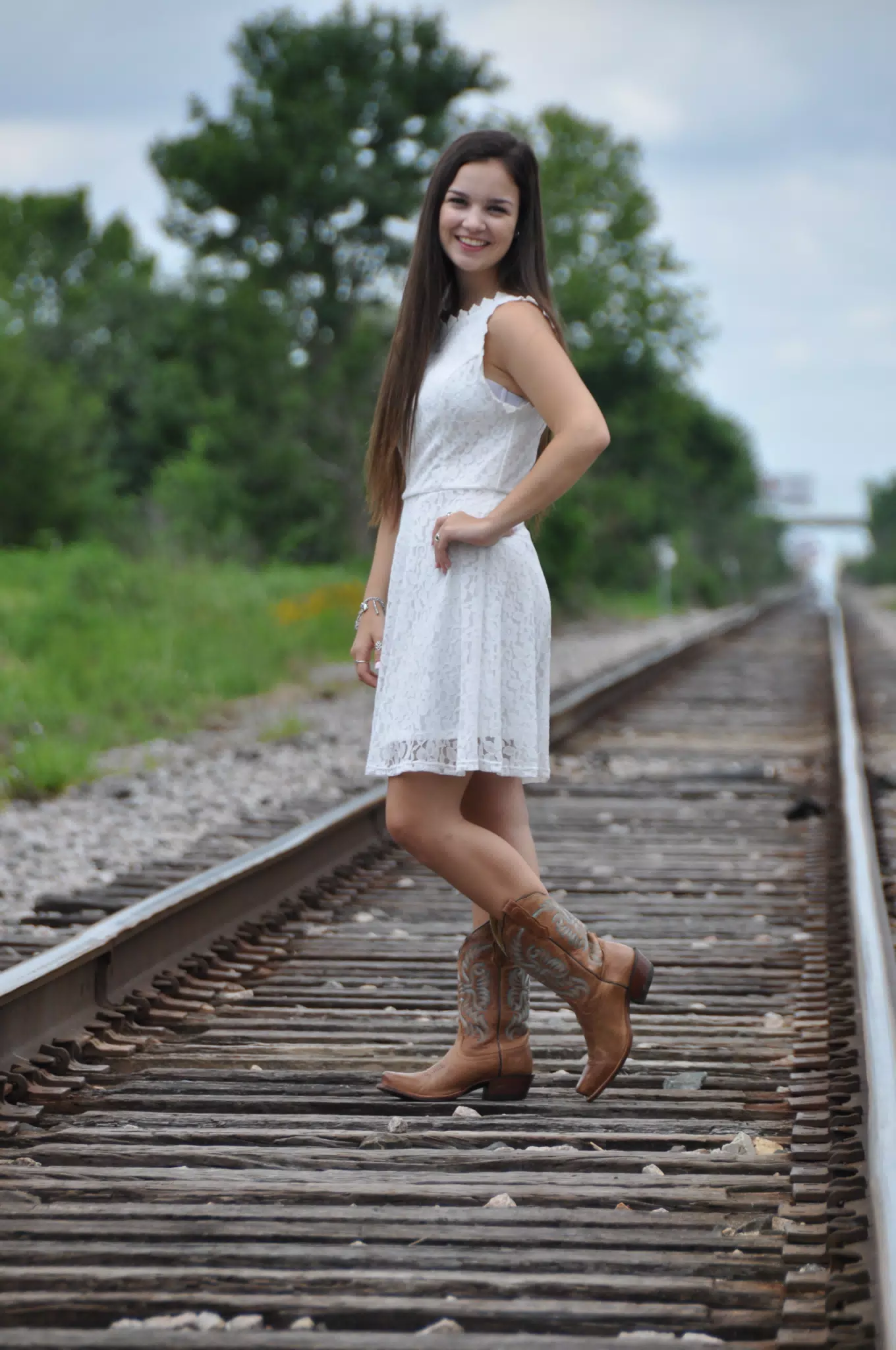 Model in White Dress on Railroad Tracks