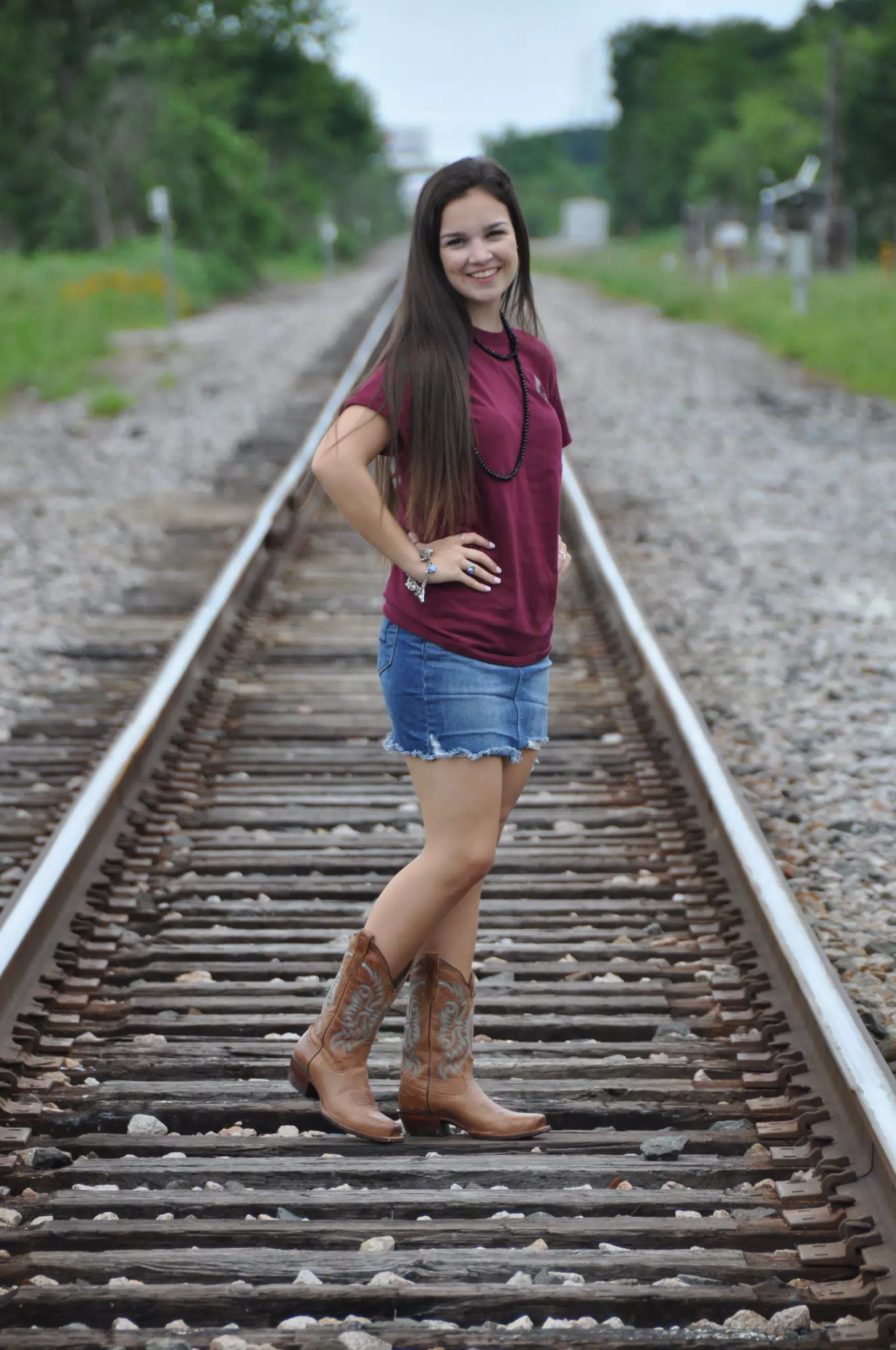 Cowboy Boots and Mini Skirt on the Train Tracks