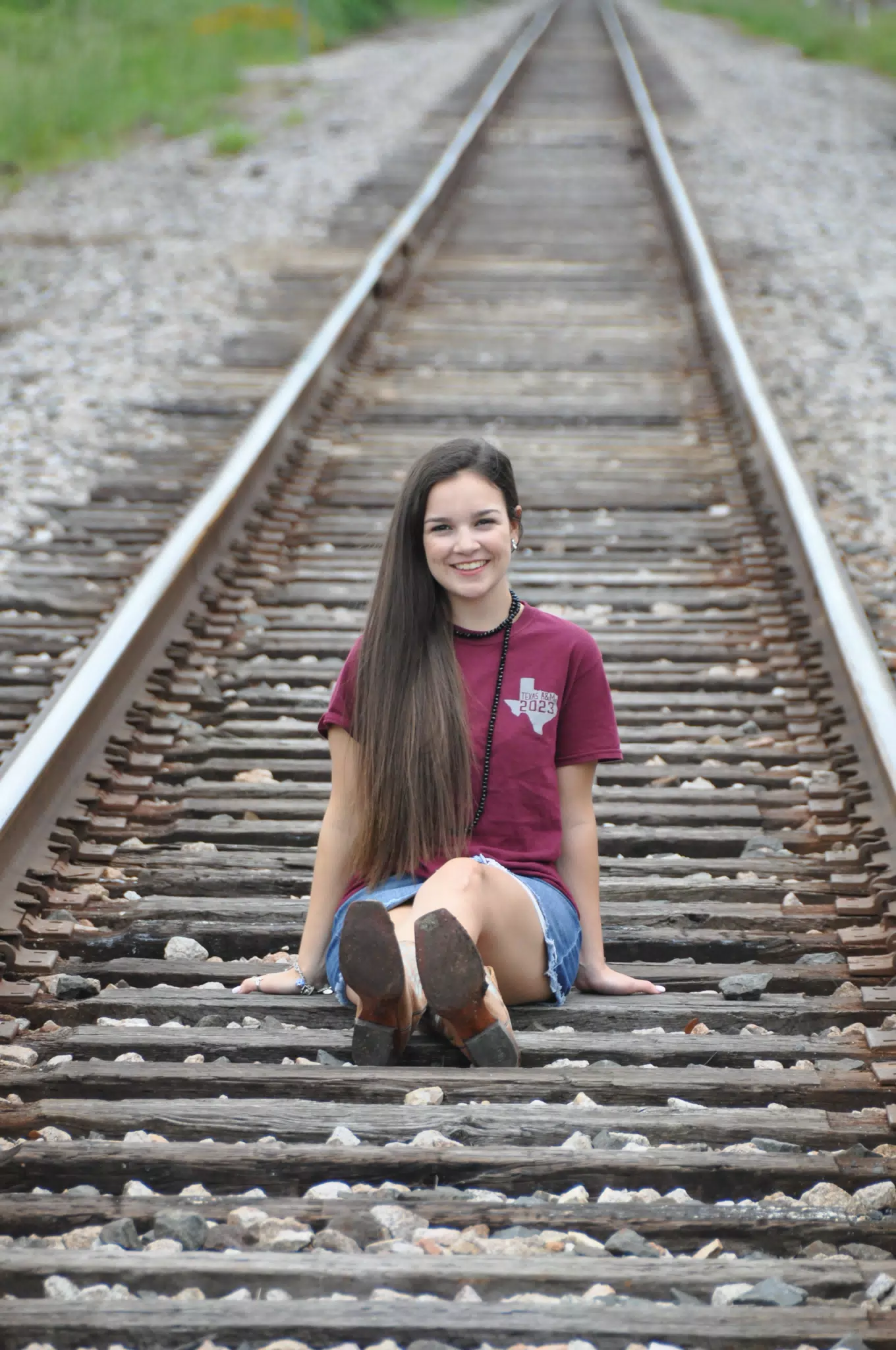 Emily on Railroad Tracks in Texas in Denim Skirt