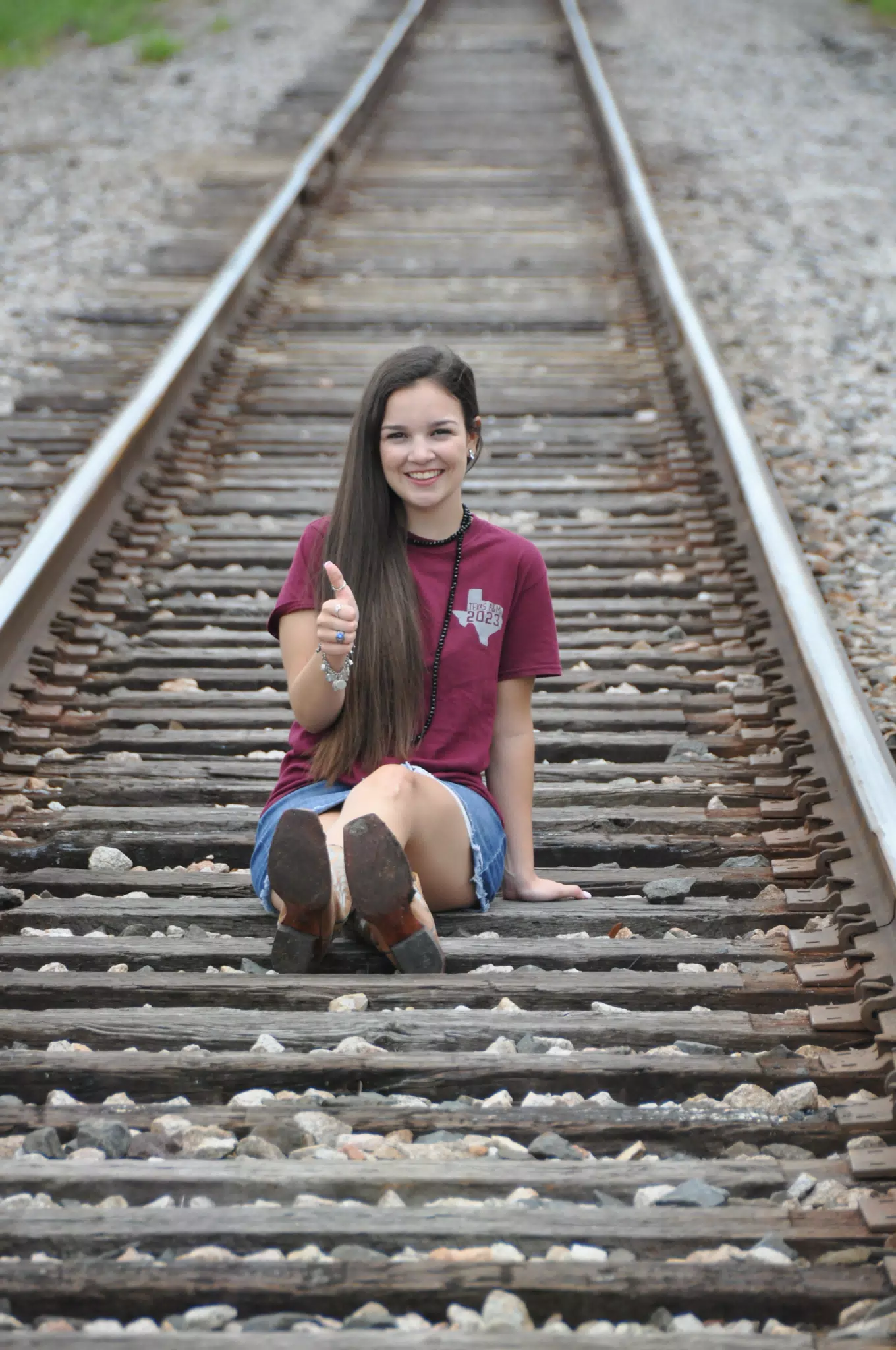 Teen Model on Railroad Tracks