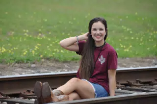 Emily Modeling on Railroad Tracks in Cowboy Boots and Denim Skirt