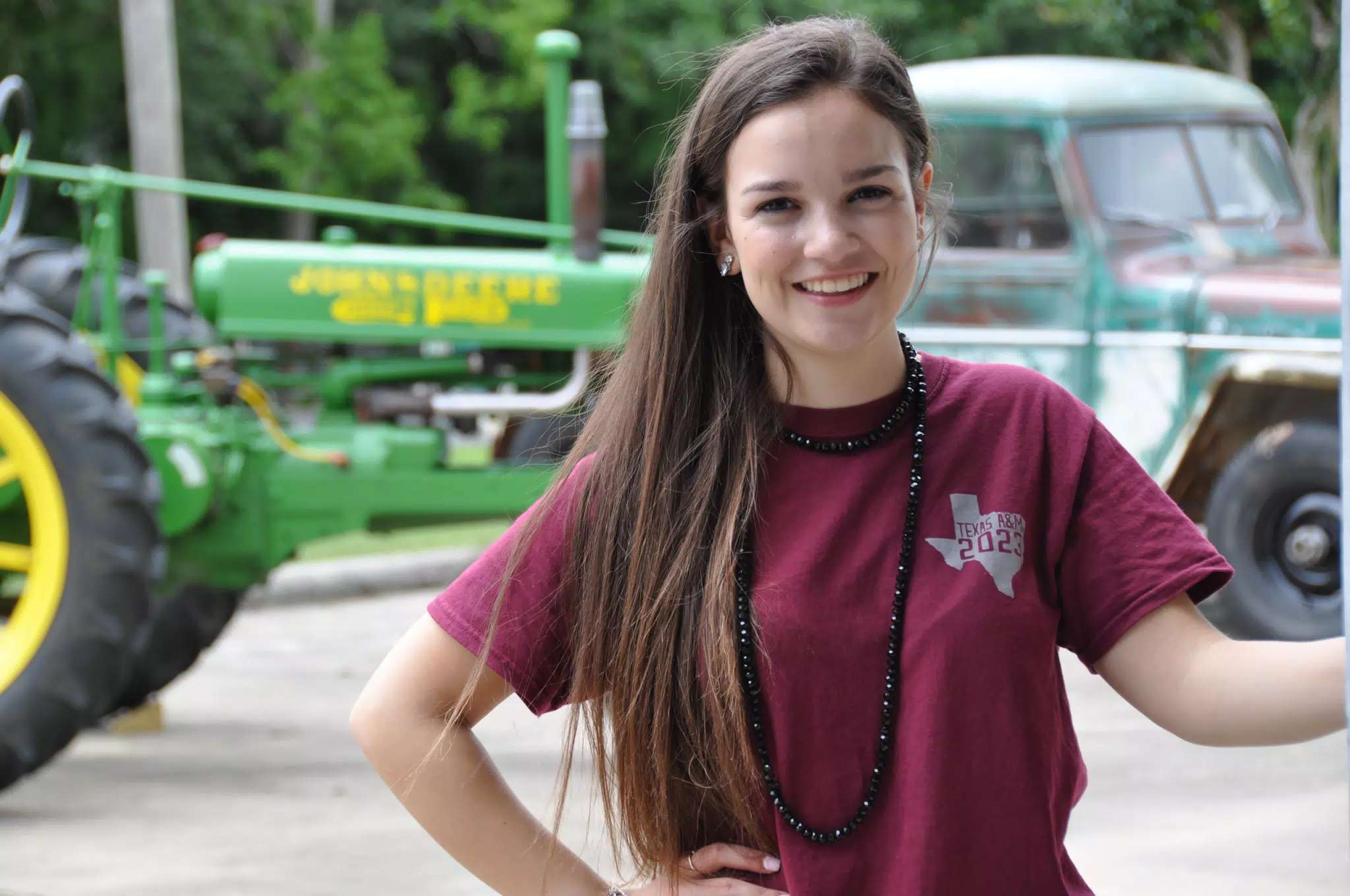 Emily Modeling with John Deere Tracktor