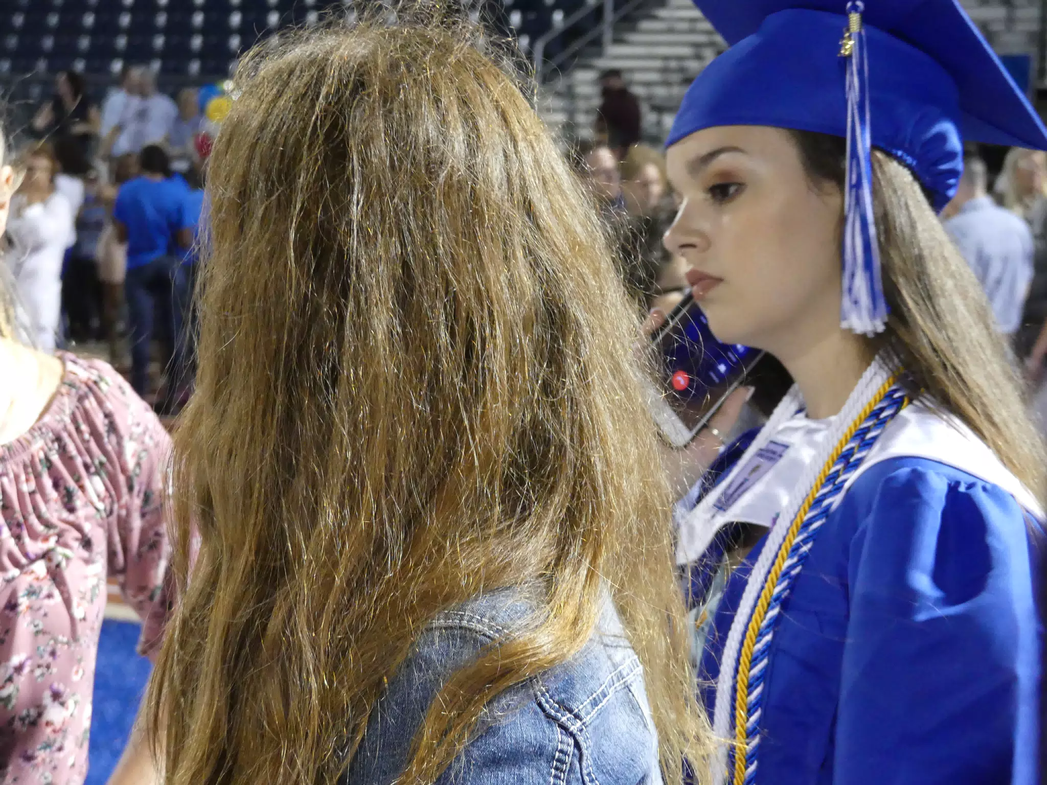 Emily on Phone at Graduation
