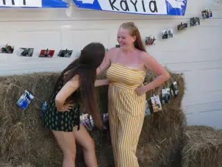 Girls Laughing with Hay