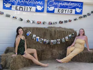 Emily & Kayla on Hay Bails at Graduation Party