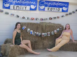 Emily & Kayla on Hay Bails at Graduation Party