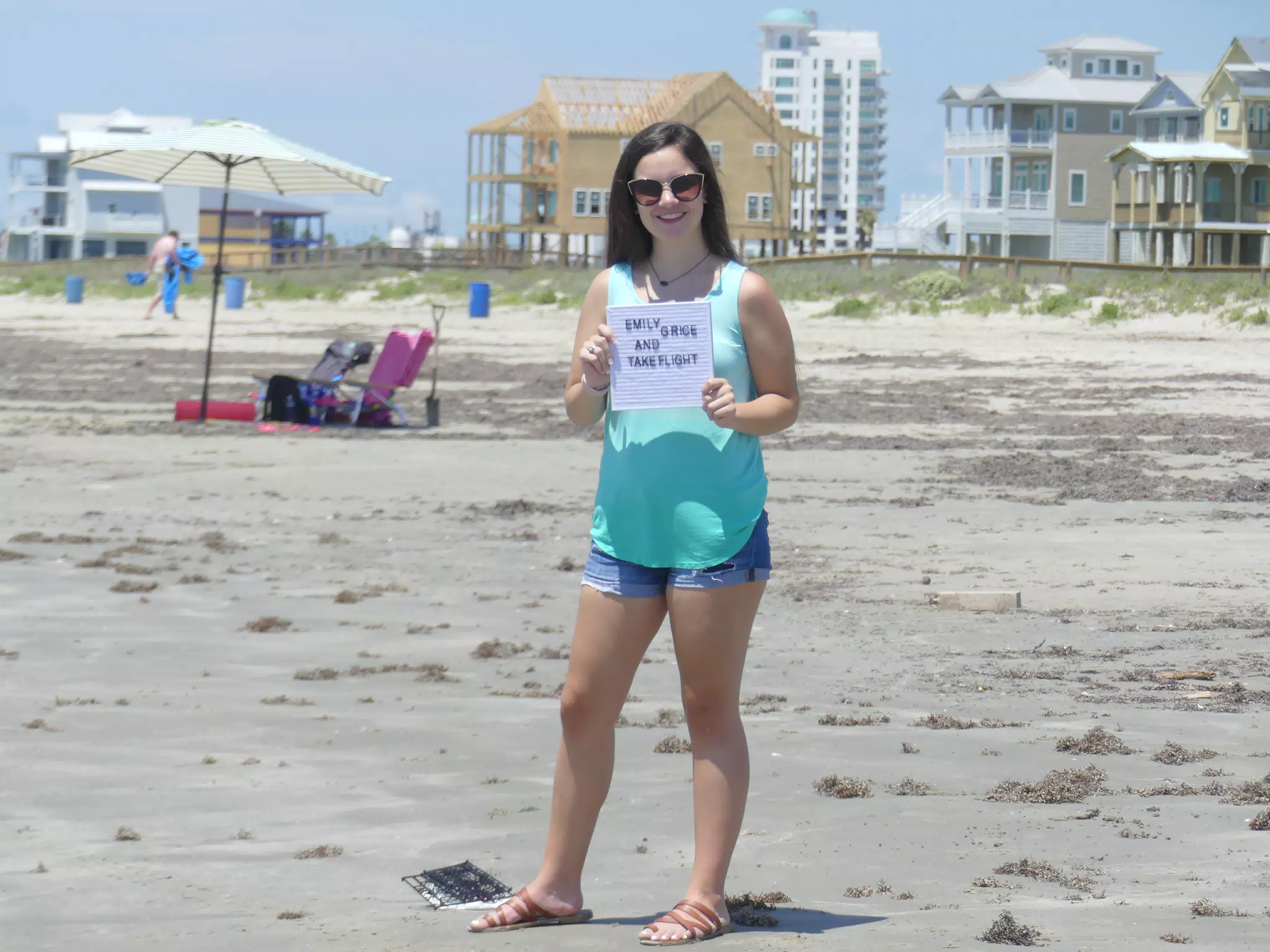 Emily on Galveston Beach with TakeFlight Sign