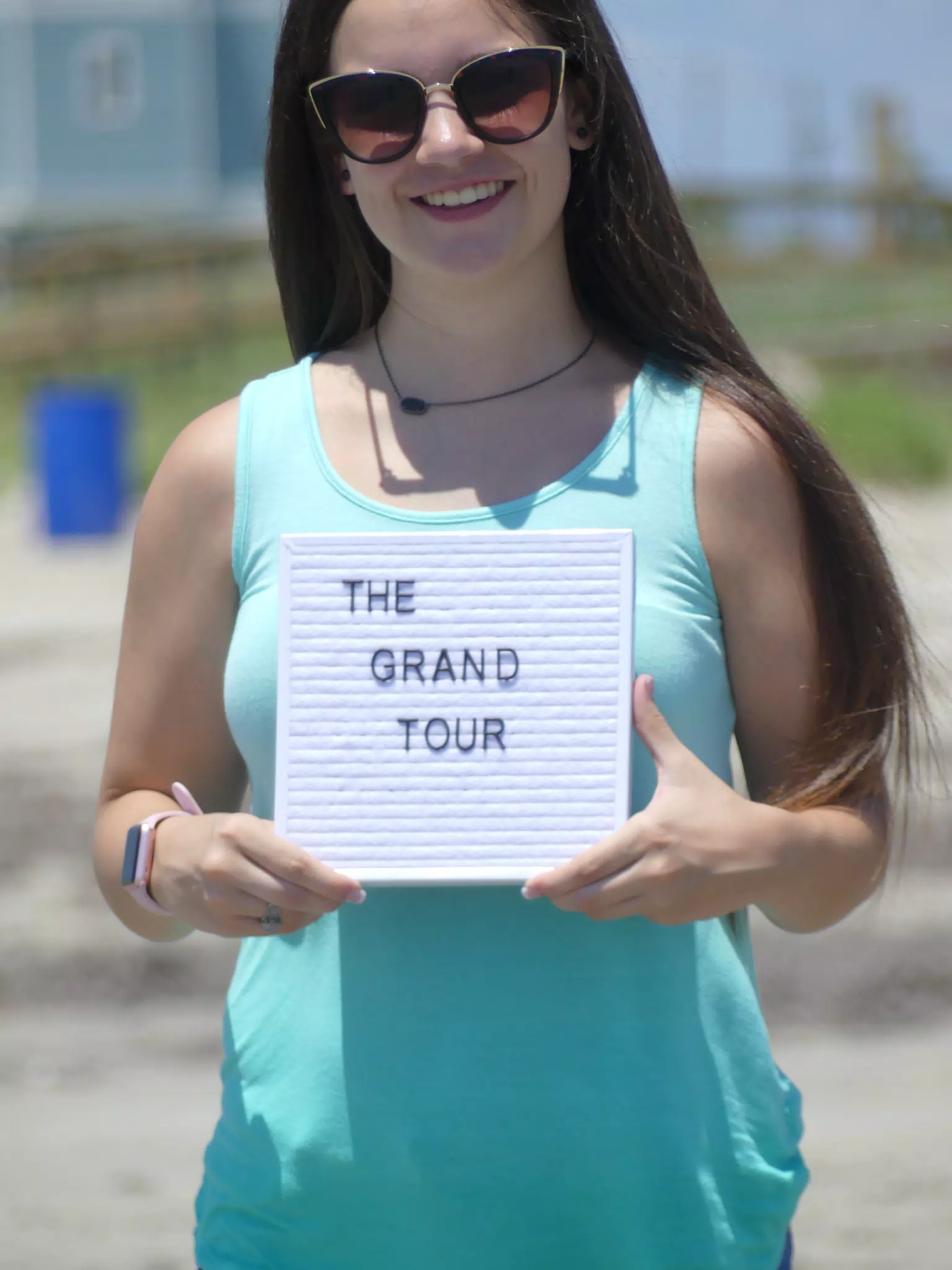Emily on Beach with Sign