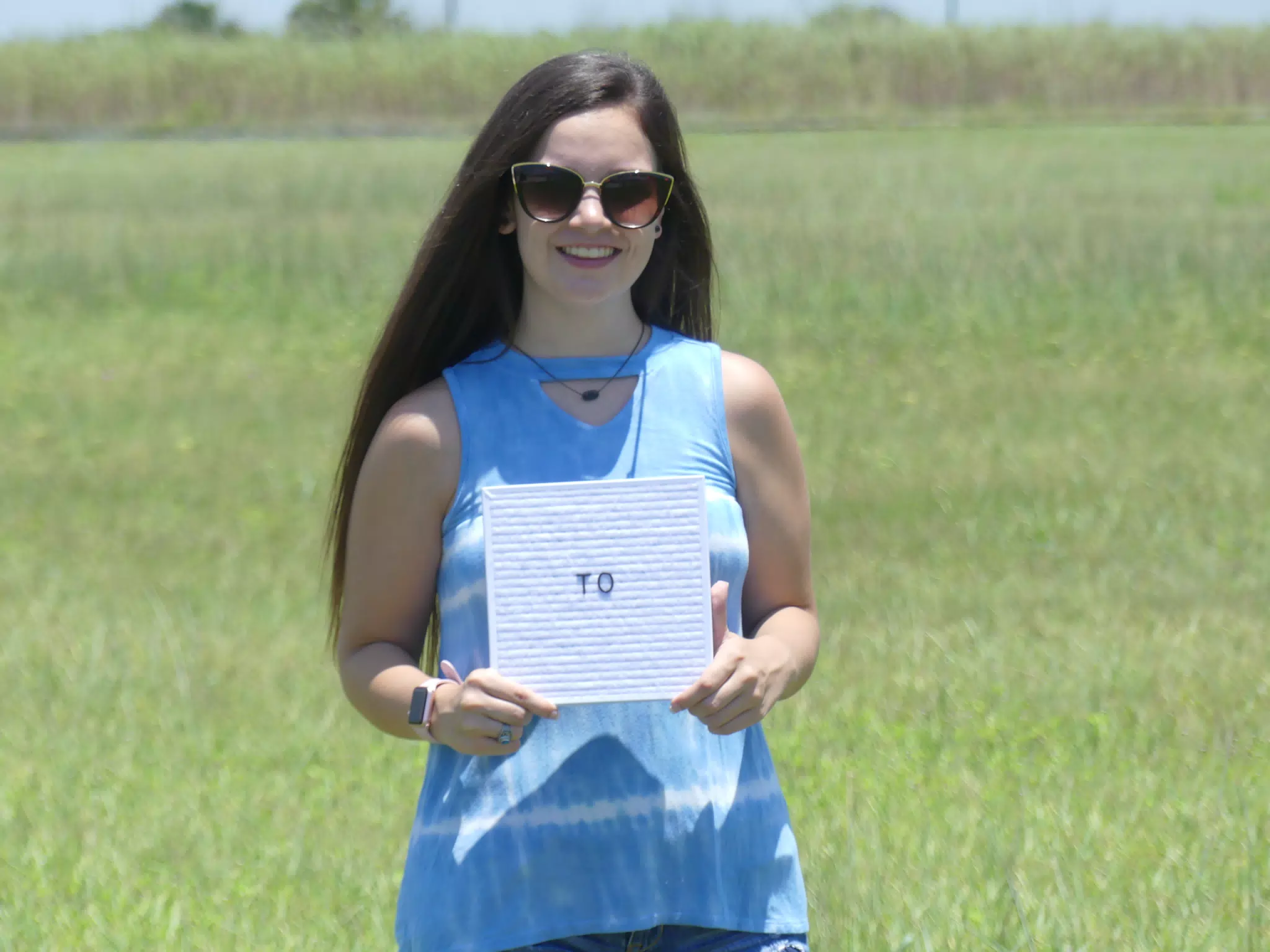 Emily with "To" Sign