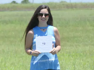 Emily in Field with Sign