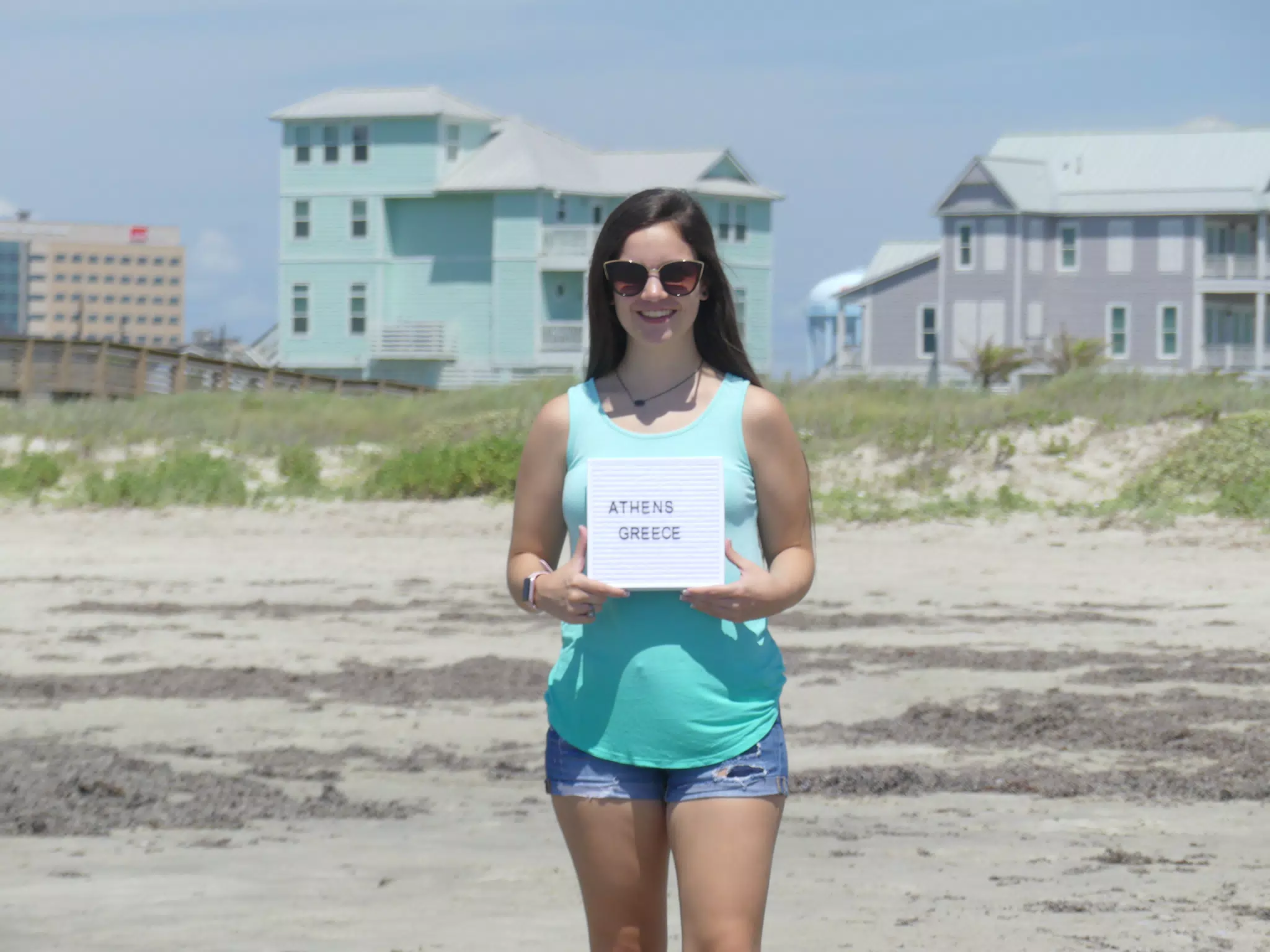 Emily with Sign on Galveston Beach