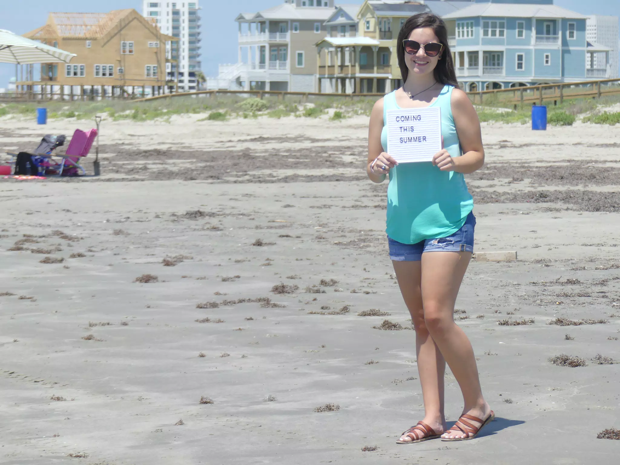 Emily with Coming this Summer Sign on Galveston