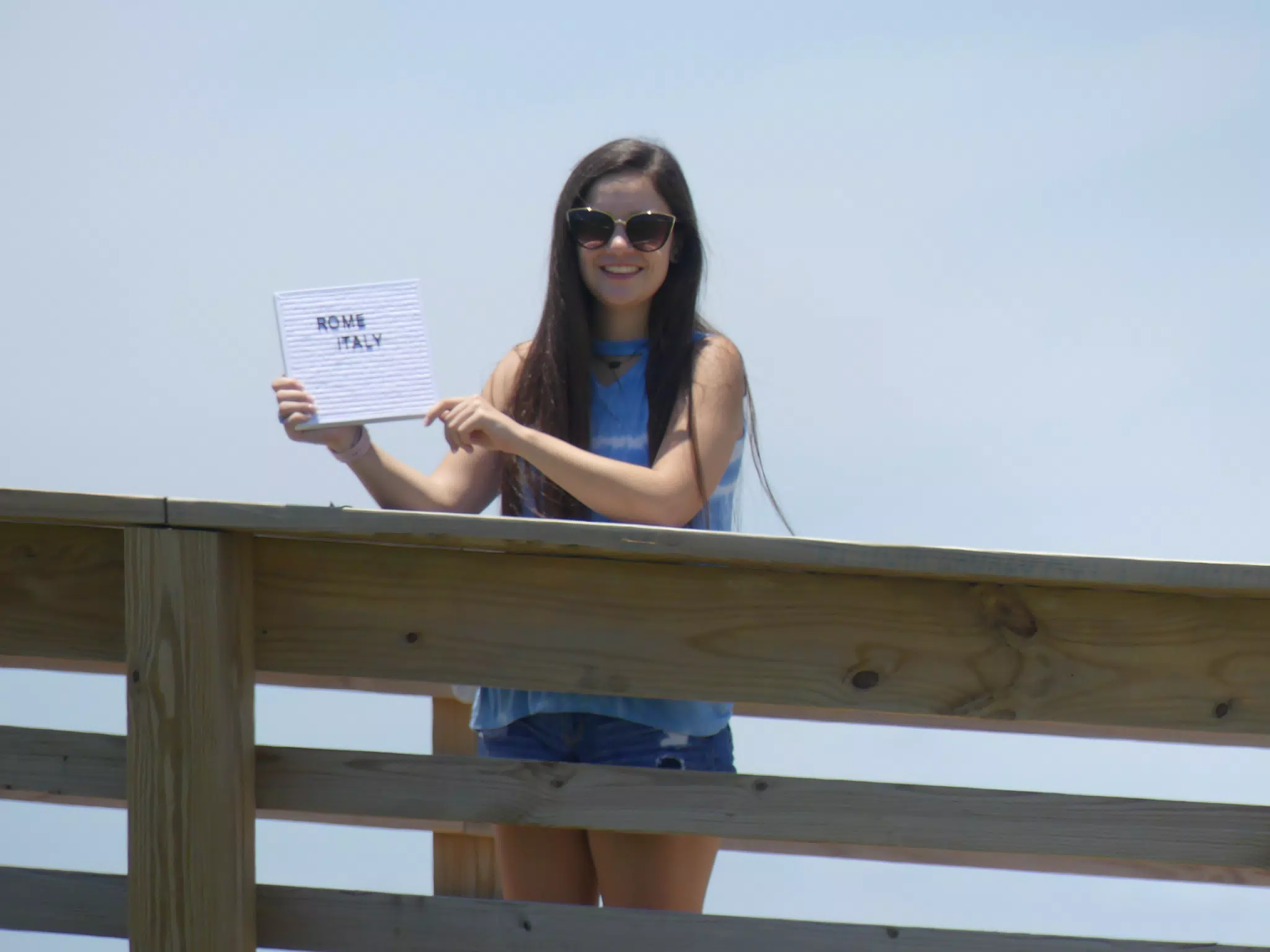 Emily on Galveston Boardwalk with Sign