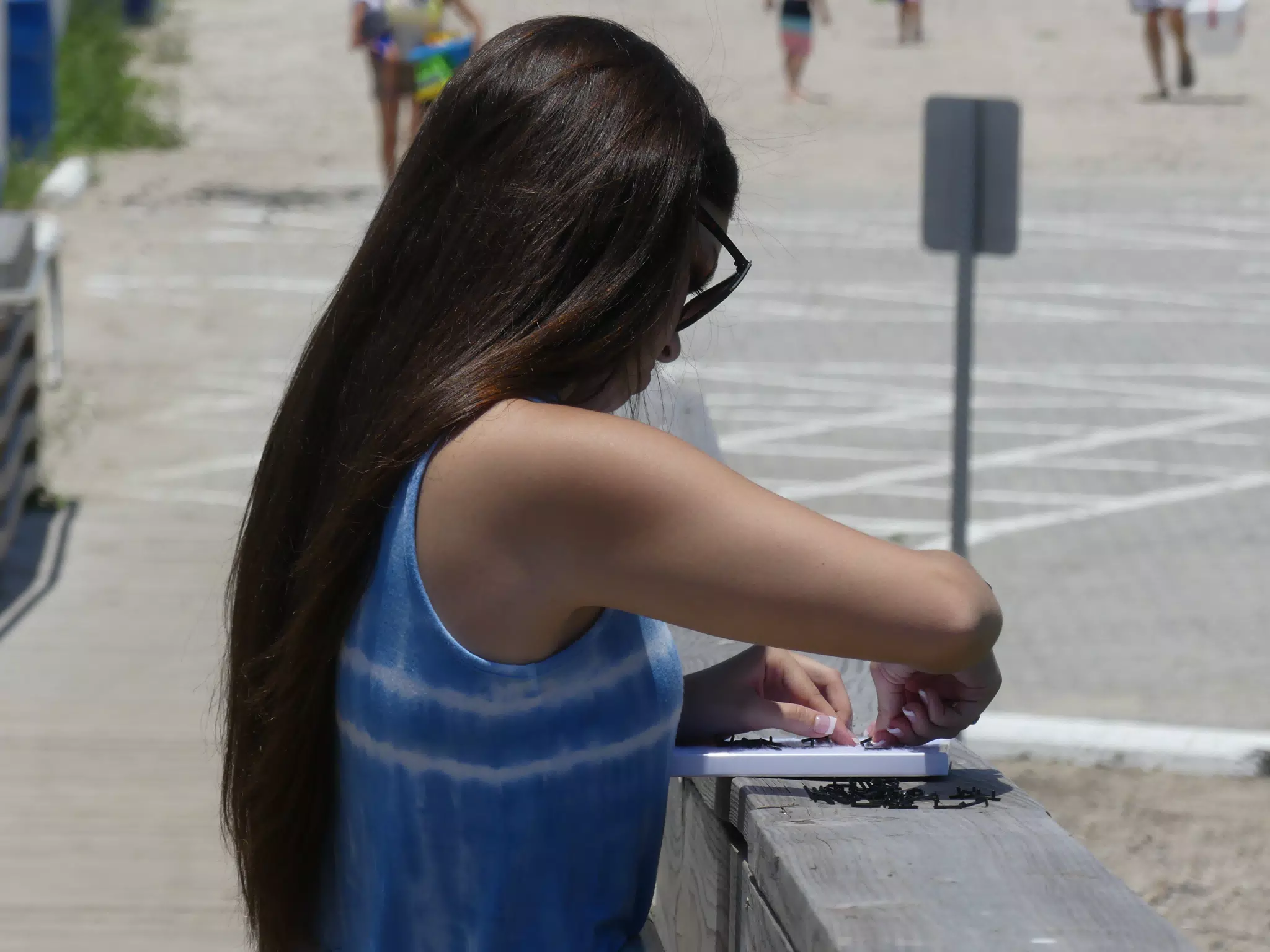 Brunette Emily Working on a Sign