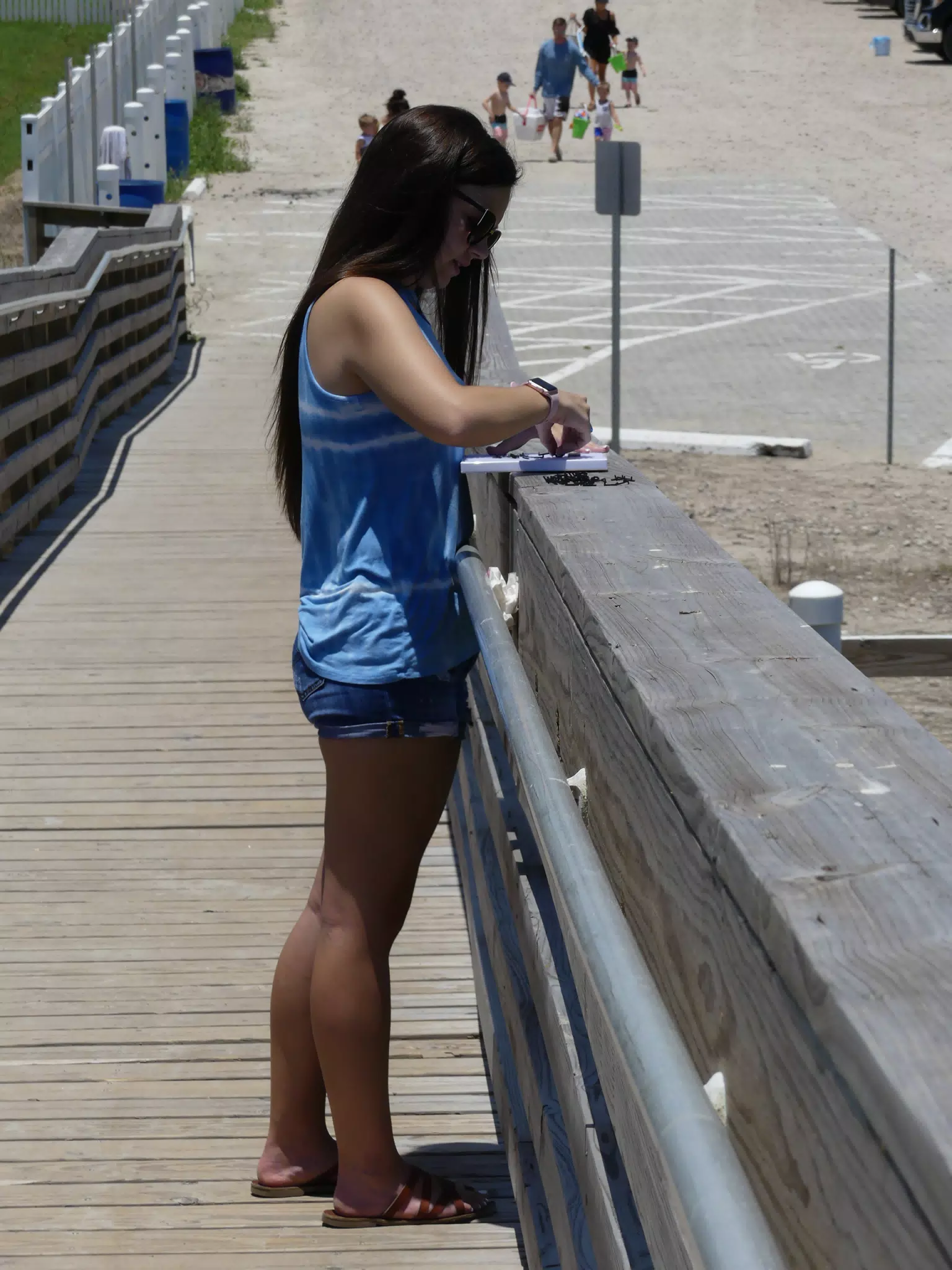 Emily on Boardwalk Working on Sign